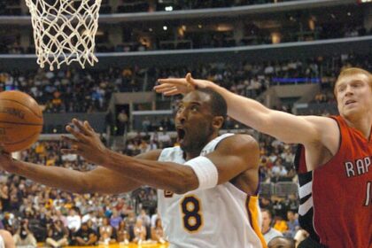Kobe Bryant scores against the Toronto Raptors