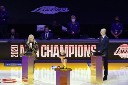Jeanie Buss, Adam Silver, Larry O'Brien trophy.